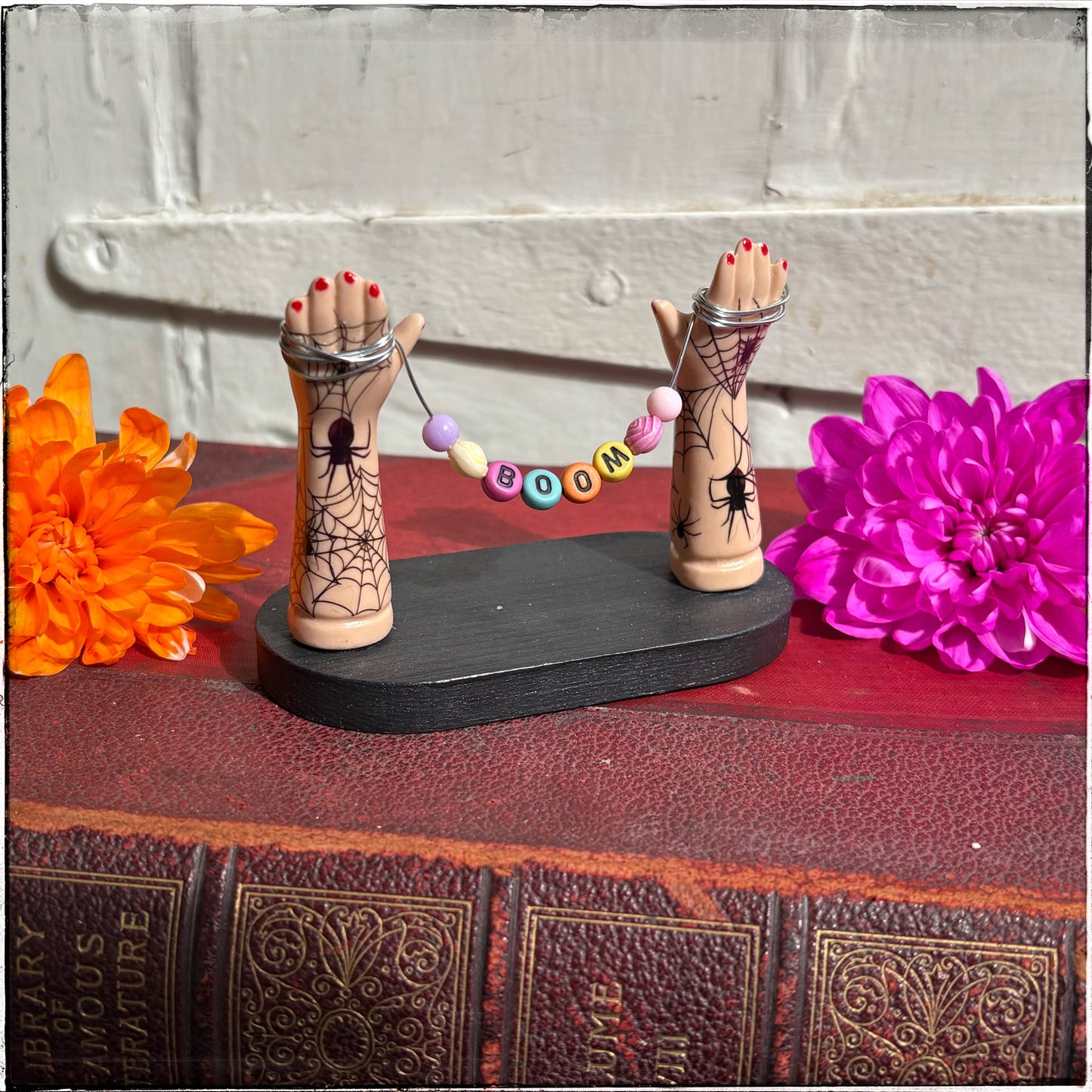 Small Recycled Porcelain Doll Arm Sign Holder - BOOM