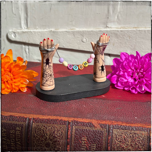 Small Recycled Porcelain Doll Arm Sign Holder - BOOM