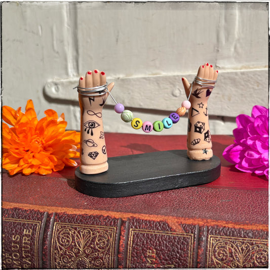 Small Recycled Porcelain Doll Arm Sign Holder - Smile