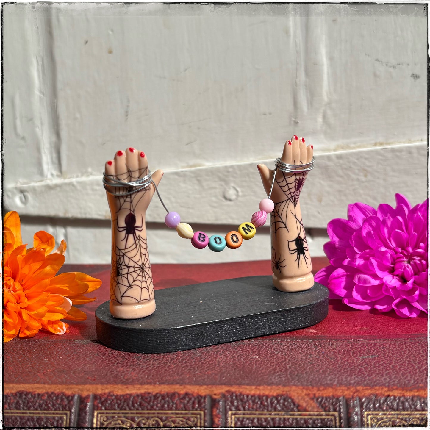 Small Recycled Porcelain Doll Arm Sign Holder - BOOM