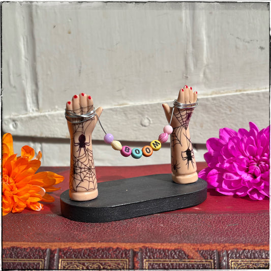 Small Recycled Porcelain Doll Arm Sign Holder - BOOM