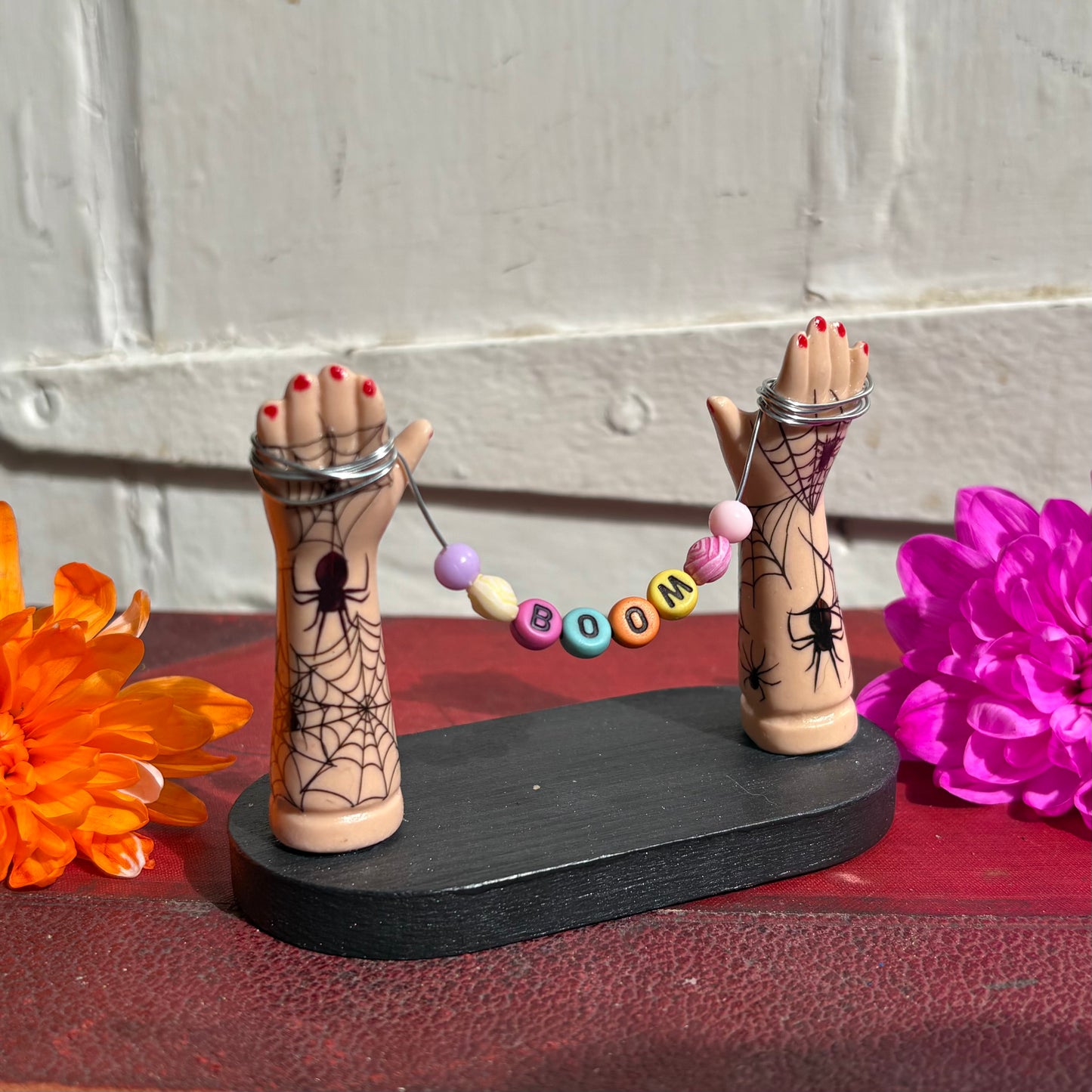 Small Recycled Porcelain Doll Arm Sign Holder - BOOM